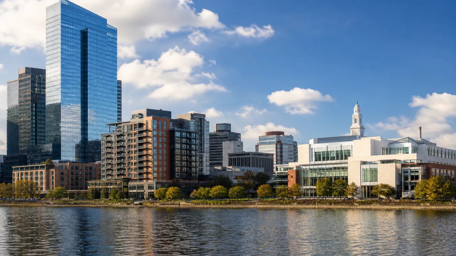 Diverse commercial property types across a modern city waterfront skyline