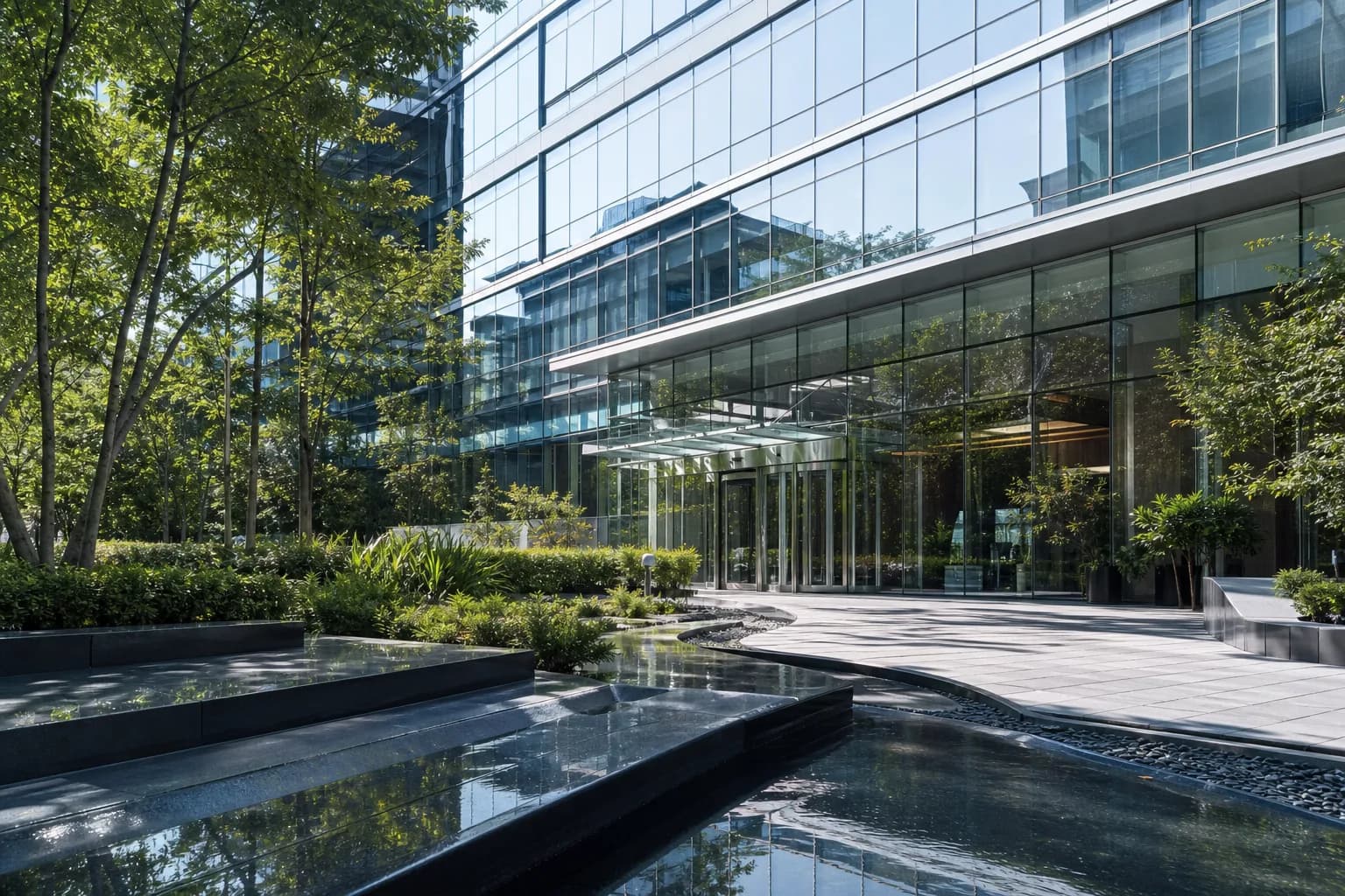 Representative Class-A commercial office courtyard and glass curtain wall entrance plaza